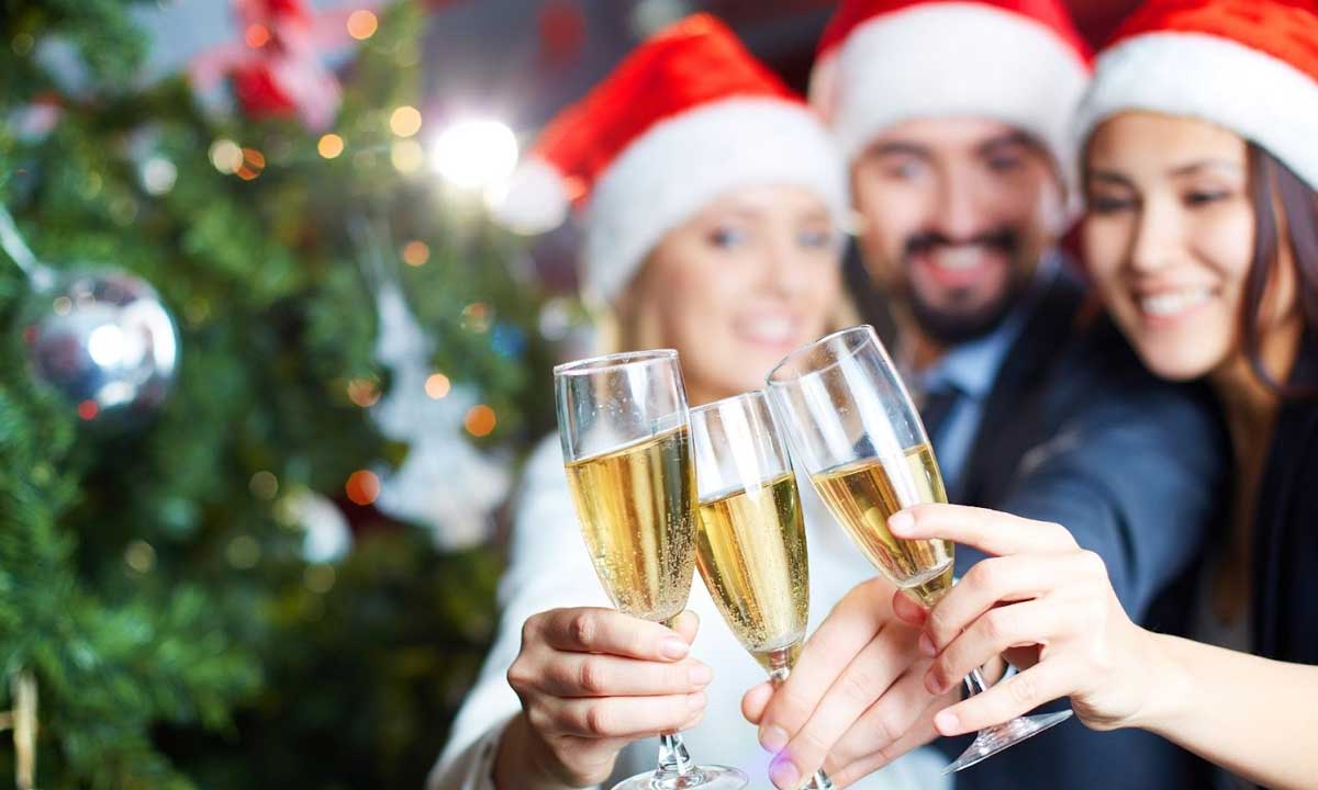 Young people welcoming the new year with champagne