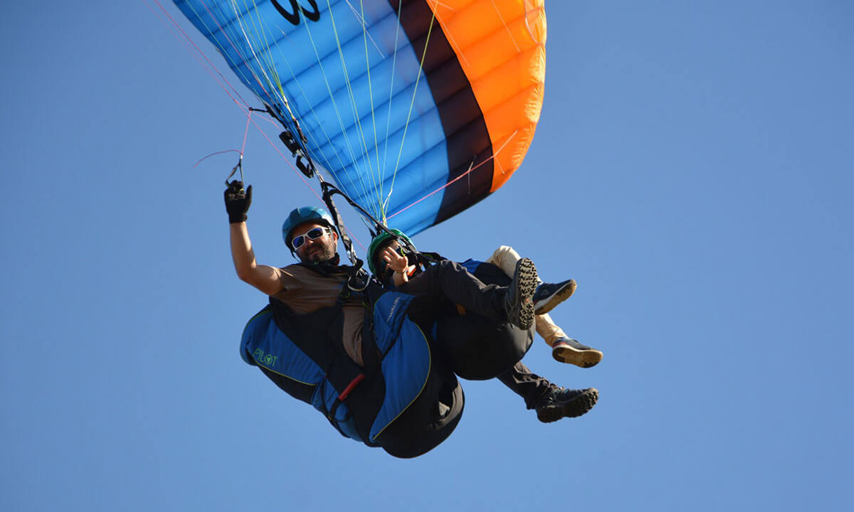 Instructor and student paragliding in Maspalomas