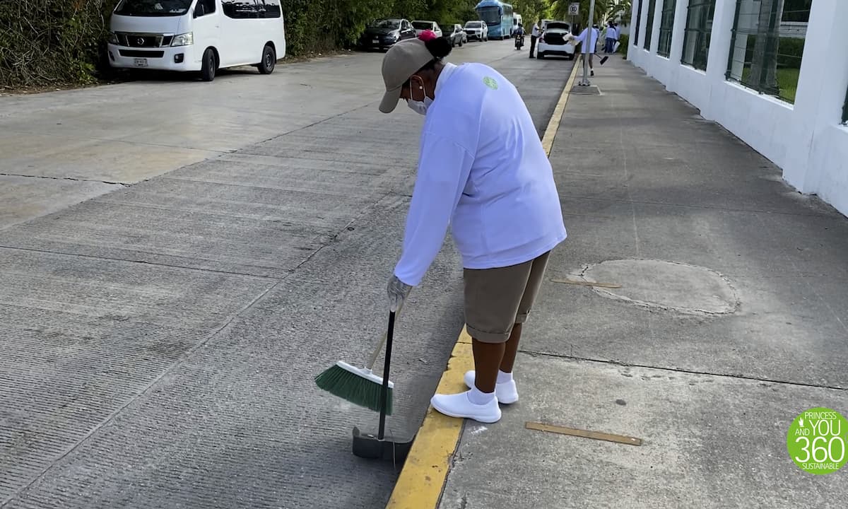 A member of the team cleaning the street