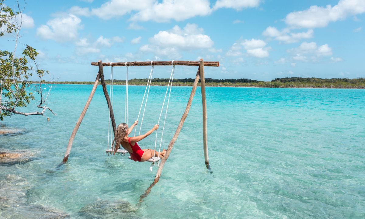 A woman on a swing in the sea off Isla Mujeres