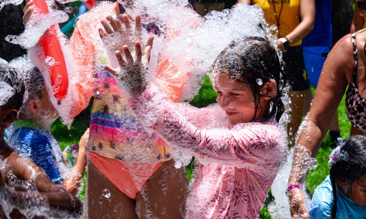 Children playing in a Princess Family Club Riviera foam party