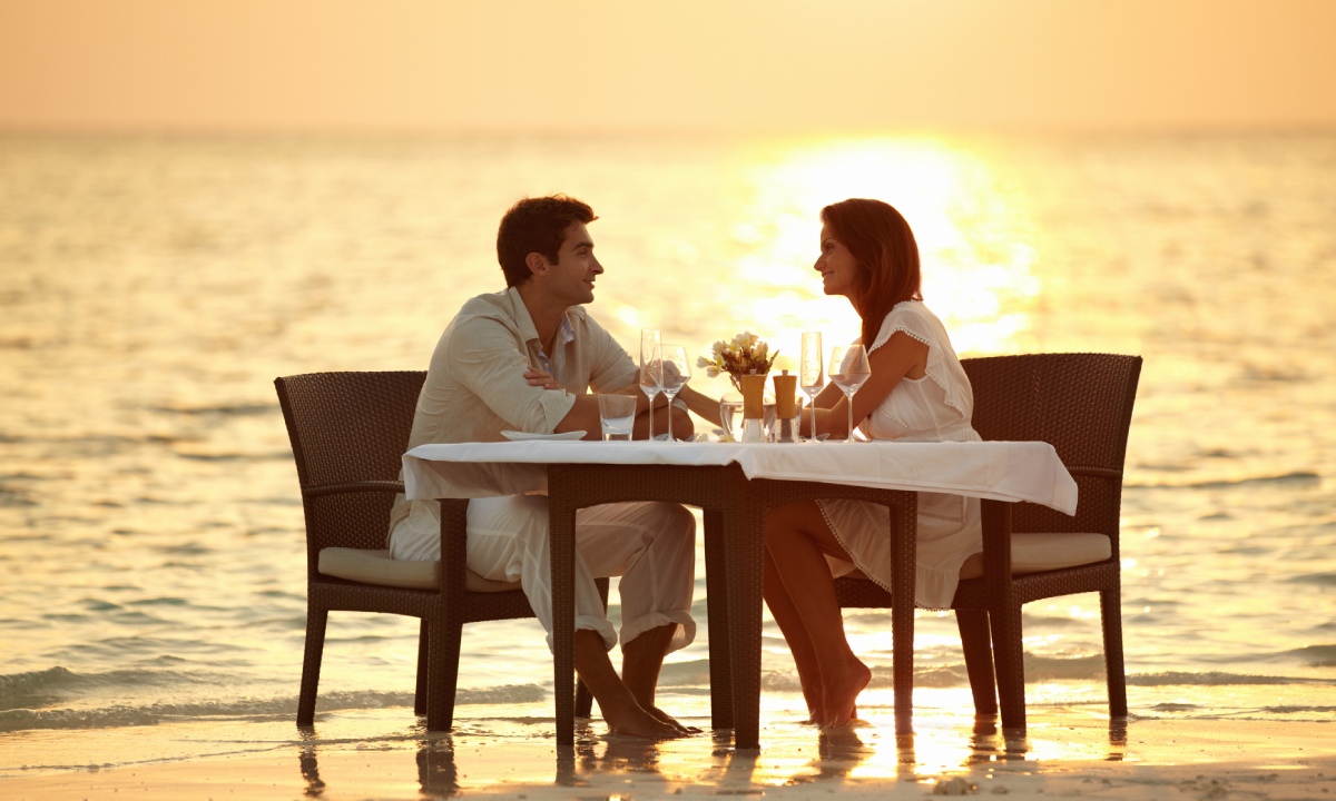 A couple dining on the beach