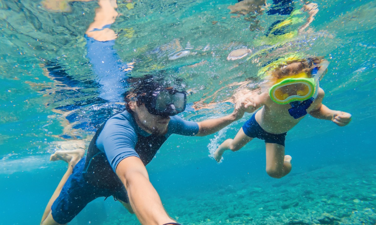A father and son snorkelling