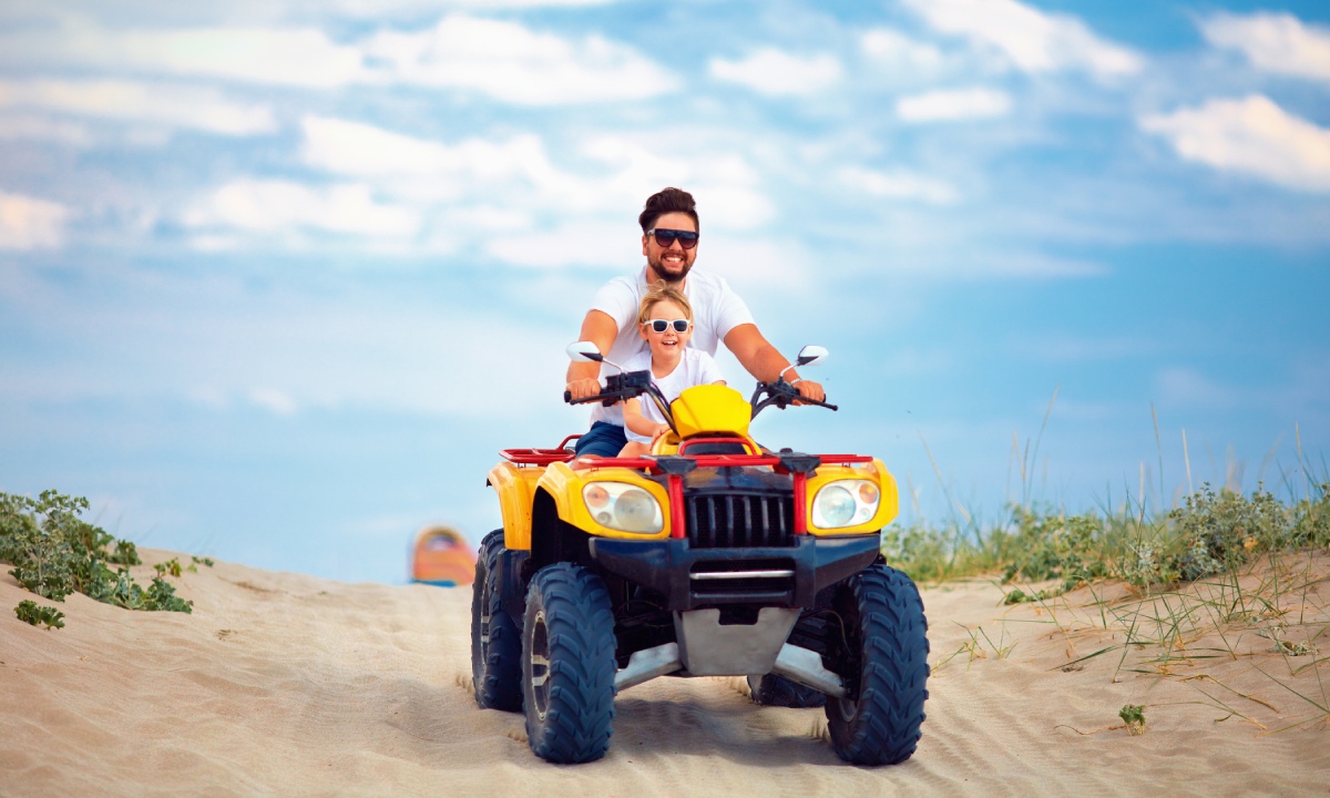 A father and son on a quad bike