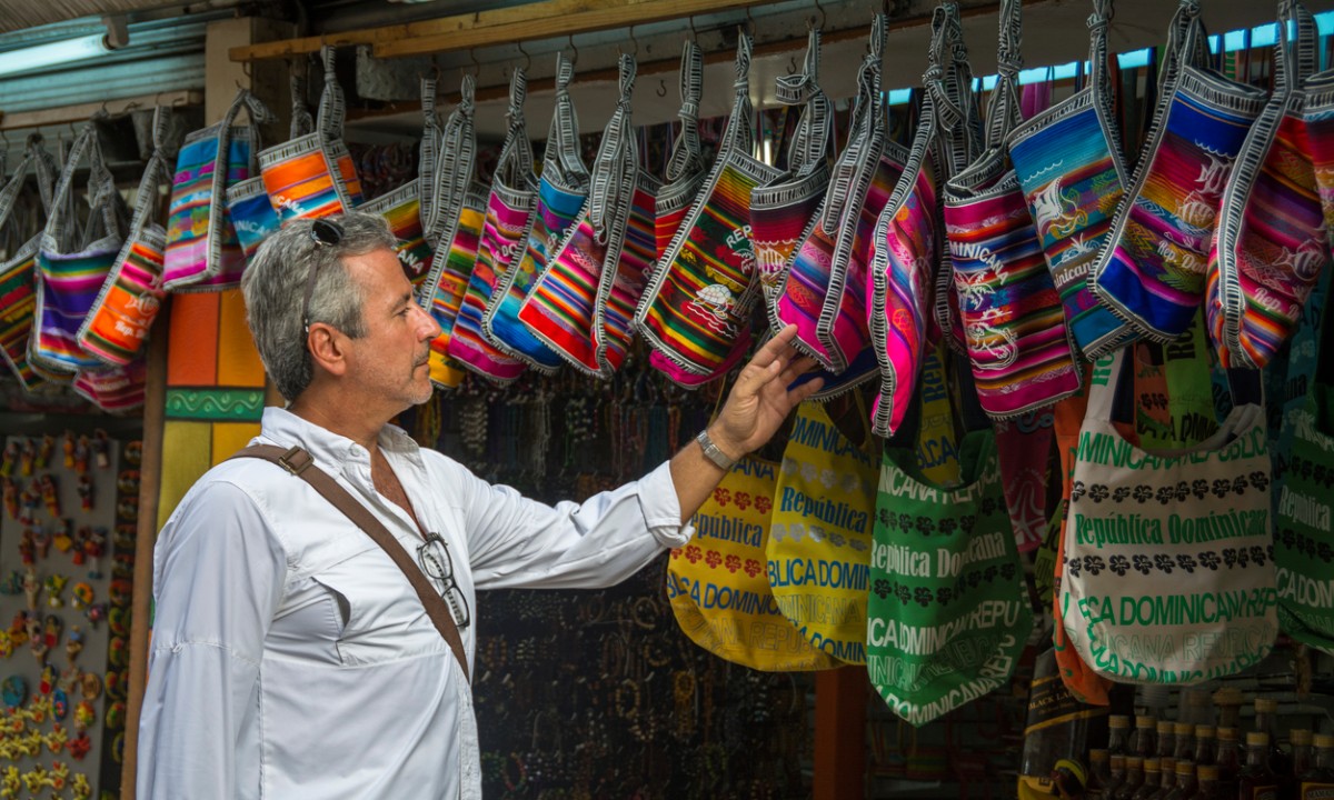 A man selling bags in the market