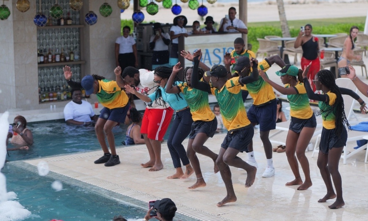 Hotels Entertainers dancing at foam party in the pool