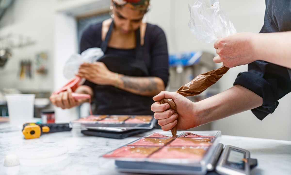 Women making chocolate at Pure Chocolate Jamaica
