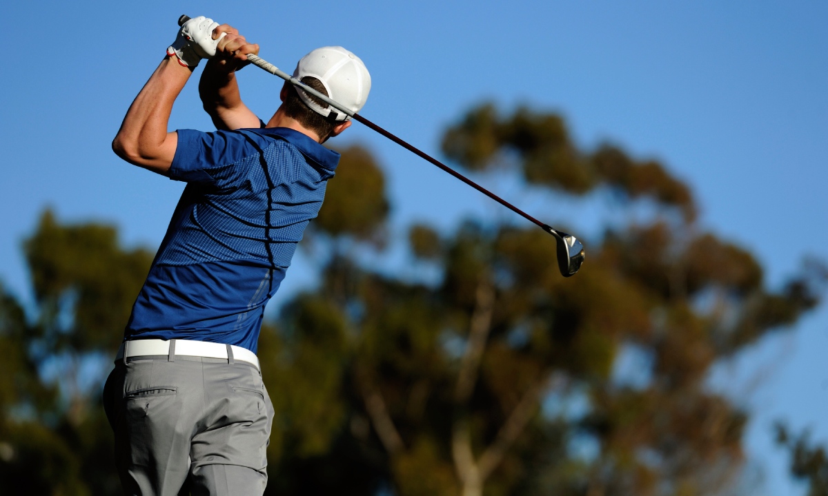 A man playing golf