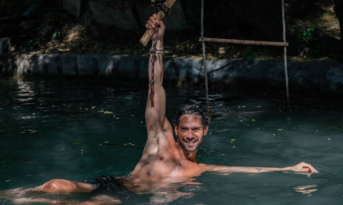 Man swimming in the Blue Hole Mineral Spring