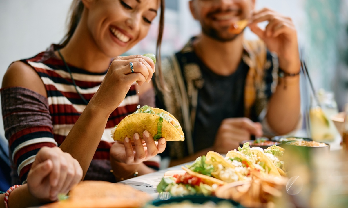 A woman eating a taco