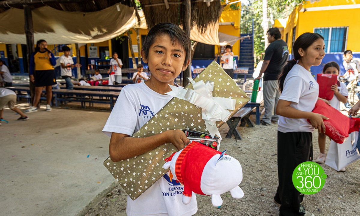 A boy with a gift and a soft toy