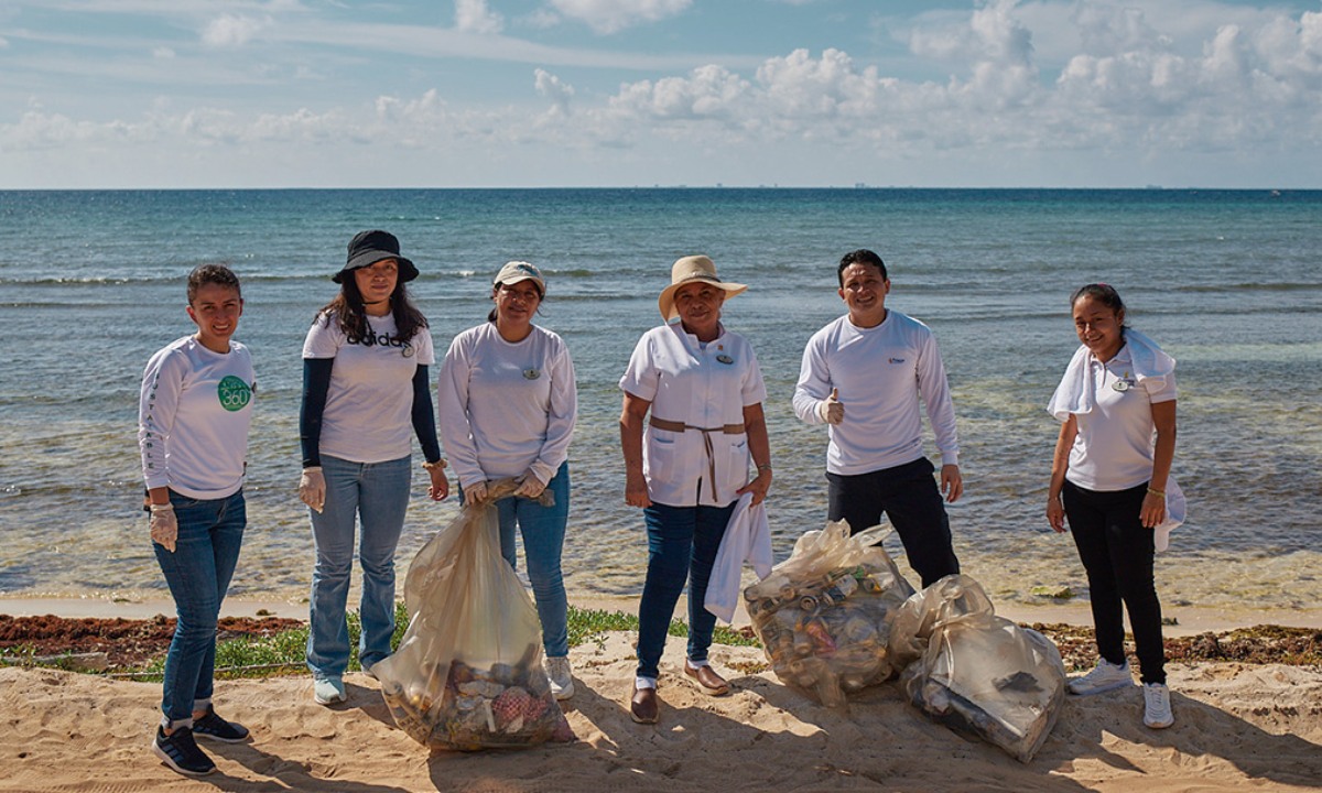 Princess Hotels staff collecting rubbish on the beach