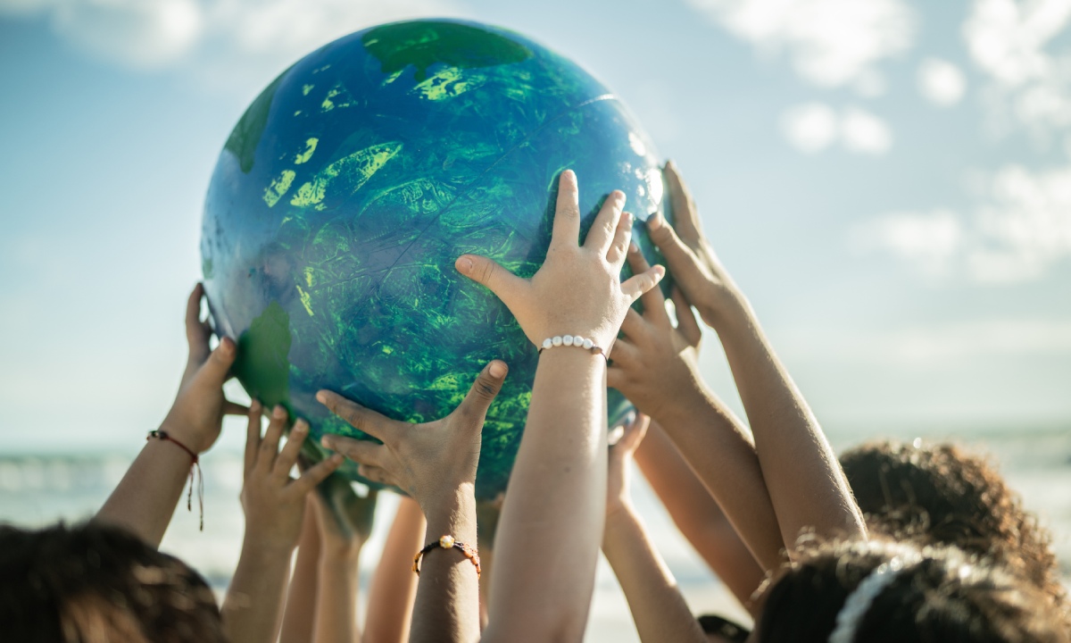 Hands holding the planet Earth