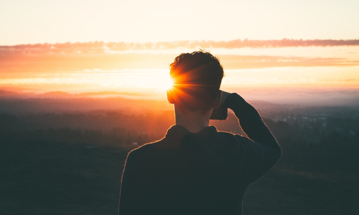 Man taking photographs of the sunset in Tenerife