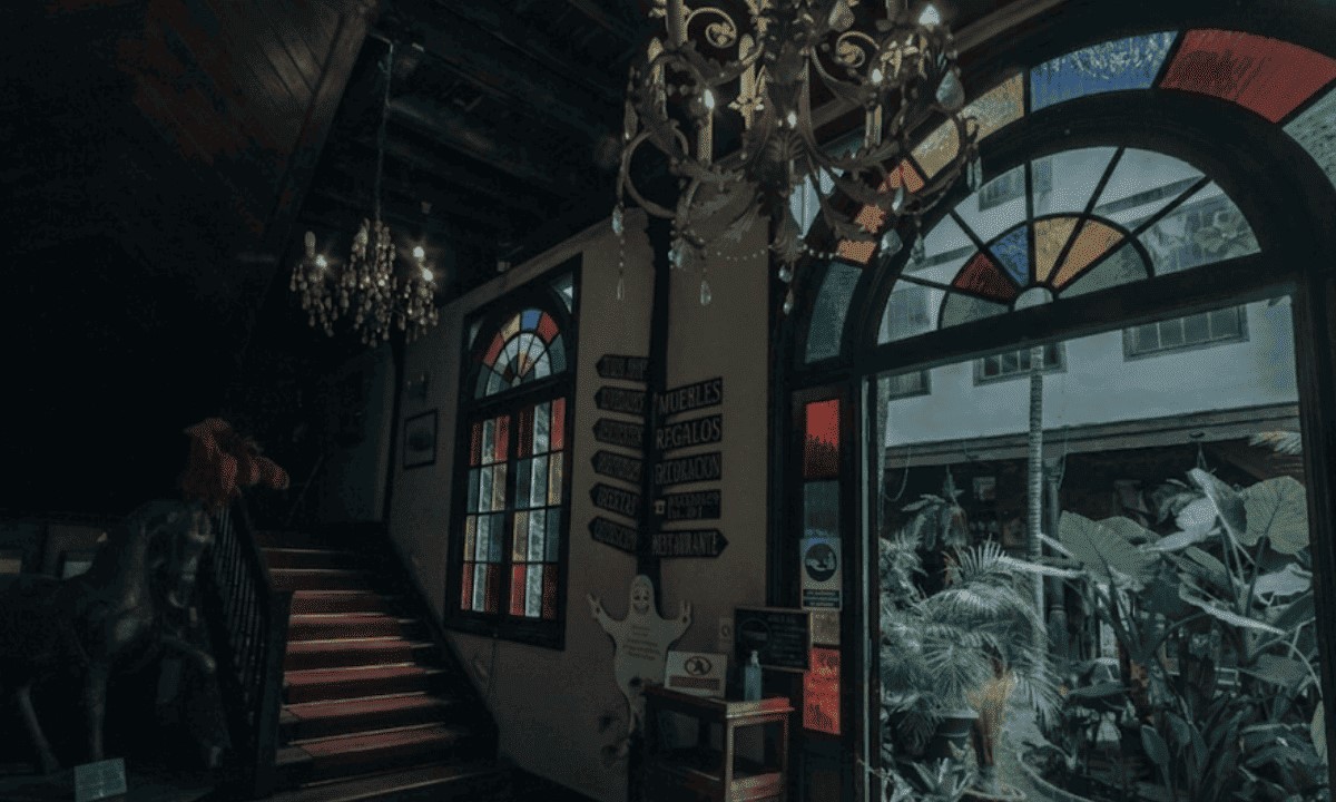 Interior of Casa Lercaro in San Cristóbal de La Laguna, with stained-glass windows, chandeliers and an old staircase