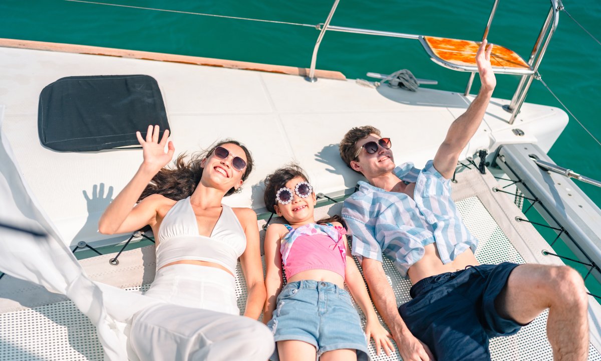 arents with their daughter on the deck of a boat